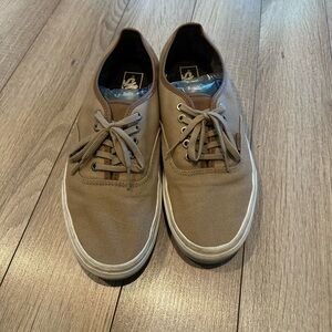 Khaki vans with brown leather tongue